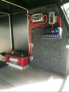 the inside of a vehicle with some electrical equipment in it