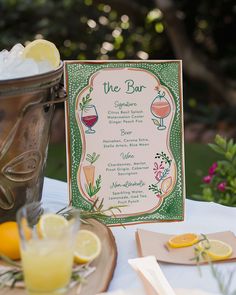 a menu is set up on a table with lemons