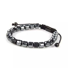 24/7 Customer Service Free United States Shipping 1 Year Warranty on All Products Adjustable size Handmade with Care Black Cubic Zirconia Black Metal Beads Live fearlessly with this stunningly black crystals bracelet. Black Metal beads sure to make a visual masculine statement. Black crystals give a perfect shine! Stack this trendy piece with any of our beaded bracelets, Red or Black String pieces for the ultimate look.The bracelet comes in a elegant black box that will protect from scratches. A Black Hematite Jewelry With 8mm Beads, Adjustable Beaded Gunmetal Jewelry, Adjustable Gunmetal Beaded Jewelry, Adjustable Black Crystal Bracelet With Black Beads, Black Beaded Hematite Bracelets, Black Hematite Bracelets With Spacer Beads, Black Hematite Jewelry With Spacer Beads, Black Hematite Beaded Bracelet, Black Hematite Crystal Bracelet With 8mm Beads