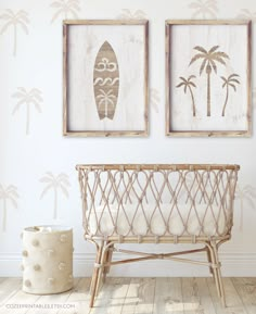 two framed pictures hang on the wall next to a wicker basket with a surfboard in it