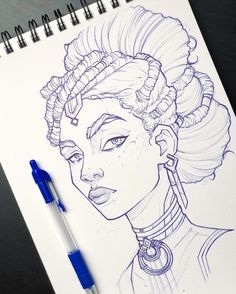 a drawing of a woman's head with braids on it and a pen next to it