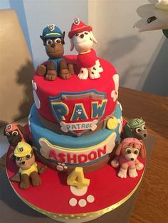 a birthday cake decorated with paw patrol characters