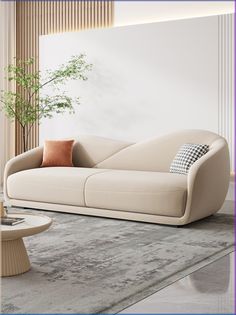 a white couch sitting on top of a rug in a living room