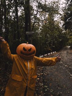 a person wearing a jack o lantern costume