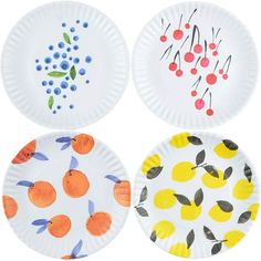 four paper plates with fruit designs on them