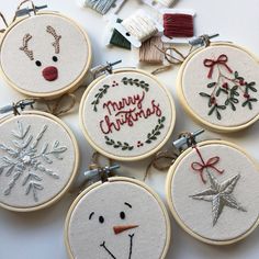 embroidered christmas ornament kits displayed on white surface