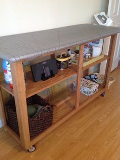 a kitchen island made out of an old bookcase with shelves and baskets on top