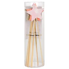 three wooden sticks in a clear box with a pink star on top