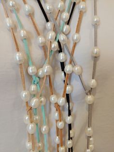 Pearl lariat is made with over 30 white freshwater pearls. One long strand of suede leather to wrap several different ways for any neckline. It is 50" long, long enough to triple as a choker (see photo). Choose from 9 colors. The neutral colors like Tan, Camel & Black are most popular. I love the Aqua & Navy Blue when I'm decked out in a beachy look. The finishing charms will be sent in the color they are in the photo. If you prefer to specify SILVER or GOLD, just leave a note at checkout. Adjustable Lariat Long Necklace, Adjustable Single Strand Lariat Necklace, Adjustable Lariat Jewelry For Layering, Adjustable Lariat Necklace For Everyday, Adjustable Handmade Long Necklace For Layering, White Adjustable Lariat Jewelry, Adjustable Single Strand Lariat Necklace As Gift, White Handmade Adjustable Long Necklace, White Single Strand Lariat Necklace