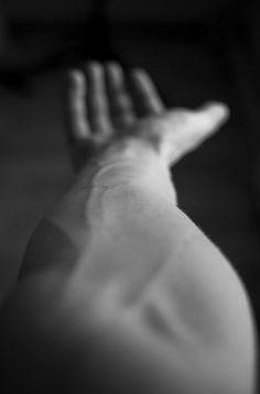 black and white photograph of a person's arm