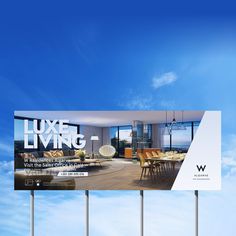 a billboard with the words luxury living on it in front of a blue sky and white clouds