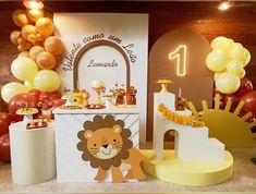 a lion themed birthday party with balloons and decorations