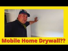 a man standing in front of a whiteboard with the words mobile home drywall?