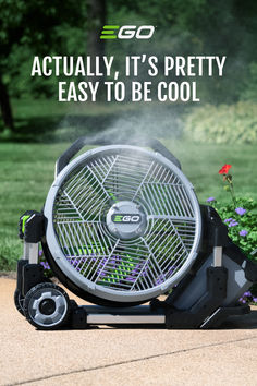 an outdoor fan sitting on top of a sidewalk next to flowers and grass with the words, actually, it's pretty easy to be cool