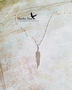 A fantastic sterling silver feather on an 18" sterling silver beaded link chain.  (See EXTRAS below for Lotus necklace in 4th picture.)This necklace is of incredible quality. I use only high quality sterling silver.DETAILS...............................................................Pendant: Length: 1.25"  Width: .25"  (mm): 35 x 7Available: Sterling SilverChain: Sterling Silver 1.9mm 18" beaded link chain See EXTRAS for longer chain CHECKOUT..................................................... Silver Feathered Sterling Silver Necklaces, Silver Sterling Silver Necklaces With Feathers, Native American Feathers, Silver Feather Necklace, Lotus Necklace, Feather Necklace, Silver Feather, Sterling Silver Cuff Bracelet, Feather Necklaces