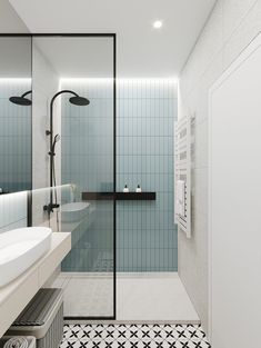 a bathroom with black and white tile flooring next to a walk - in shower