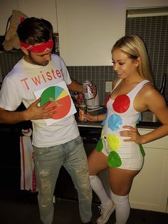 a man standing next to a woman in a kitchen