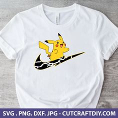 a t - shirt with a cartoon pikachu riding a surfboard