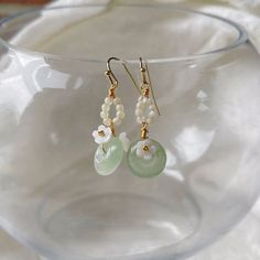 ⭐️ Introducing our Chinese vintage style dangles that the dangly part is made in synthetic jade that's in a light green color with beaded flowers surrounding.  ⭐️ The dangles showcase intricately designed Chinese elements, adding a cute and elegant touch to your look. ⭐️ Crafted with hypoallergenic materials, these earrings offer a comfortable and safe wearing experience.  ⭐️ The lightweight design makes them perfect for everyday wear or as an exquisite accessory for formal events. ⭐️ Ideal for various occasions, including weddings, parties, or adding a touch of elegance to your daily outfits. ⭐️ It also goes very well with Chinese Qipao dress or Hanfu. ✈️ Handling & Shipping usually takes about 10 days in total, so please consider the processing time if it's a time sensitive gift. 🌹 We a Jade Beaded Drop Earrings, Jade Beaded Dangle Earrings For Gift, Green Jade Dangle Beaded Earrings, Jade Earrings With Dangling Beads As A Gift, Green Jade Beaded Drop Earrings, Green Jade Beaded Earrings For Gift, Adjustable Jade Beaded Dangle Earrings, Birthday Gift For Best Friend, Chinese Vintage