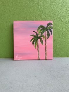 a painting of two palm trees against a pink sky