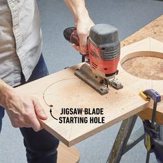 a man using a jig saw to cut a piece of wood with the word jigsaw blade starting hole