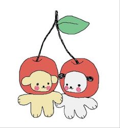 an apple and a bear hanging from a tree branch