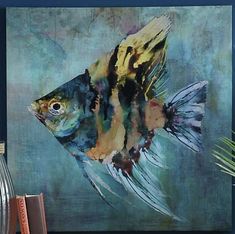 a painting of a colorful fish on a blue background