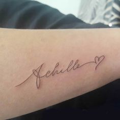 a woman's arm with the word amelie written in cursive writing on it