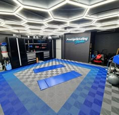 a garage with blue and gray checkered flooring