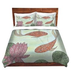 an image of a bed with flowers and fish on it