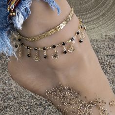 Beautiful 2 Piece Gold Toned Anklet Set. The First Anklet Features Black Crystals And Dangling Black Crystals With Dangling Filigree Flowers. The Second Anklet Is A Gold Toned Chevron Design. Wear Them Together Or Separate To Change Your Look. The Flower Anklet Is Approx. 8” With A 2.25” Extension The Chevron Anklet Is Approx. 8.25” With A 2” Extension See My Other Listings For More Jewelry. Bundle And Save On Shipping. #A58 Black Bohemian Anklets For Party, Bohemian Black Anklets For Party, Black Bohemian Ankle Wrap Anklets, Bohemian Black Ankle Wrap Anklets, Black Ankle Wrap Anklets For The Beach, Mahabharat Draupadi, Chevron Design, Black Crystals, Anklets