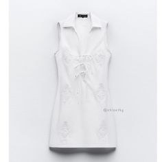 New With Tag Brand Zara Zara S/S 2024 Collection Sleeveless Dress With V-Neck Lapel Collar With Lacing. Tonal Embroidered Detail. Tonal Interior Lining. Side Hidden In-Seam Zip Closure. White / 7521/319 Outer Shell Body 100% Cotton Embroidery 100% Polyester Lining 100% Cotton Which Has At Least: Outer Shell Body 100% Ocs Certified Organically Grown Cotton *** This Item Runs Small Fitted V-neck Shirt Dress For Summer, White Cotton V-neck Shirt Dress, White V-neck Shirt Dress For Summer, White V-neck Summer Shirt Dress, White Sleeveless Shirt Dress For Beach, Summer White V-neck Shirt Dress, Fitted Zara Shirt Dress For Summer, Fitted Sleeveless Cotton Shirt Dress, Zara Fitted Shirt Dress For Summer