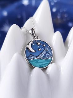 This beautiful necklace is a special and unique piece of jewel for you your best friends and a perfect gift for any occasion. This pendant was inspired by Velaris, the hidden city on the western side of the Night Court of Prythian. The pendant is made of solid 925 sterling silver and comes in the shape of a round charm with painted the Starry sky of Velaris, its mountains and the Sidra River. Product details: Material: 925 Sterling Silver Colour: Silver Size: 16mm * 16mm Chain lenght: 50+5cm adj Velaris Ring, Acotar Inspired Jewelry, Night Court Inspired Jewelry, Acotar Enamel Pins, Velaris Mug, Hidden City, Night Book, Book Necklace, Court Of Thorns And Roses