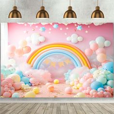 a room with balloons, stars and rainbows on the wall in front of it