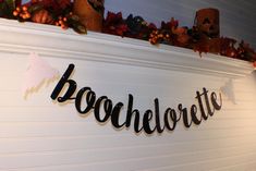 there is a sign that says boochlorette on the wall next to other decorations