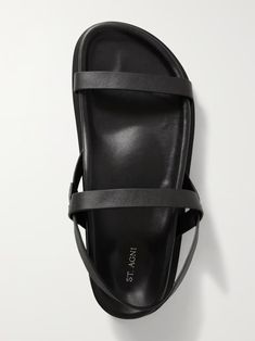 Black + NET SUSTAIN Mio leather sandals | ST. AGNI | NET-A-PORTER Sleek Black Sandals With Adjustable Strap, Sleek Black Double Strap Sandals, Sleek Leather Sandals With Strap, Black Leather Single Strap Sandals, Black Leather Sandals With Single Strap, Latest Sandal, St Agni, Leather Sandals Flat, Brown Leather Sandals