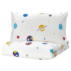 an image of a bed with space themed sheets