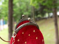 Carry your essentials in style with this adorable felted strawberry handbag. ● Handmade: Each handbag is lovingly crafted by skilled artisans, ensuring that every piece is unique. ● Cute design: Features a realistic strawberry shape with yellow seed details and a silver metal clasp. ● Spacious interior: Roomy enough to hold your phone, wallet, keys, and other daily necessities. ● Dimensions: Approximately 5" * 5.5" ● Comfortable to carry: Comes with a sturdy handle for easy carrying. ● Perfect g Cute Red Bags For Personal Use, Handmade Felt Bag For Daily Use, Rectangular Felt Bags For Gifts, Rectangular Felt Bags As Gifts, Felted Strawberry, Women Crossbody Bag, Bag Makeup, Daily Necessities, How To Make Handbags