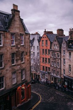 an old city street with buildings on both sides