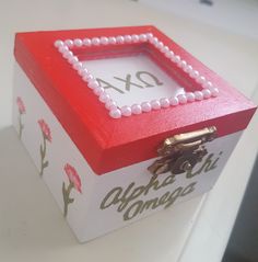 a red and white box sitting on top of a table