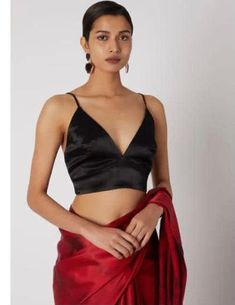 Black designer wear crop top/ sari blouse ( size- 34). Is a padded blouse and comes with a back zipper. Can be worn with both ethnic wear and contemporary attires. Silk Blouse Piece For Navratri Evening, Cropped Padded Blouse Crop Top For Party, Fitted V-neck Pre-draped Saree, Party Pre-draped Saree With Padded Blouse, Silk Cropped Crop Top For Party, Elegant Padded Cropped Top, Silk Party Wear Blouse For Diwali, Diwali Party Wear Silk Blouse, Fitted Silk Blouse For Party