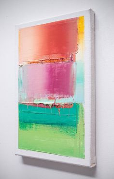 an abstract painting on a white wall with green, pink and yellow colors in the background