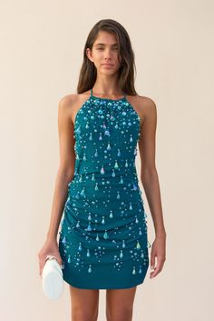 An adorned mini dress with droplet shaped beads, a high neck and an open upper back. — Mini length — Ruching throughout — Halter neck ties — Lower center back zip Artemis Dress, Hoco 2024, Beaded Mini Dress, Evening Flats, Hippie Girl, Cult Gaia, Neck Ties, White Summer, Cozy Fall