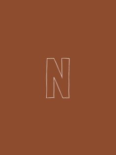 the letter n is drawn in white on a brown background with a small rectangle