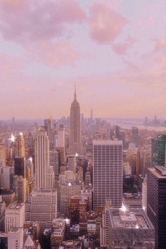 an aerial view of the city with skyscrapers and other tall buildings in the foreground