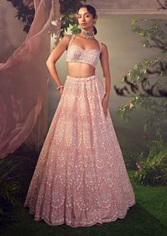 Editors Note Elevate your elegance with our orchid pink organza lehenga, adorned with intricate white thread work, embellished with sequins and bugle beads. Pink Organza Lehenga, Tulle Lehenga, Organza Lehenga, Traditional Indian Dress, Padded Blouse, Pink Lehenga, Beaded Neckline, Indian Wedding Outfits, Lehenga Designs