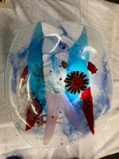 a plate that has been made to look like an abstract piece of art on it