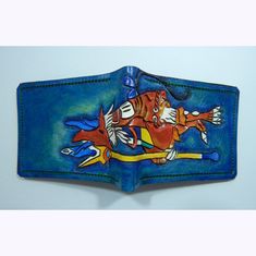 a blue leather wallet with an image of a man riding a horse on the inside