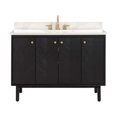 a bathroom vanity with two sinks and gold faucets on the top, against a white background