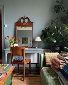 a living room filled with furniture and a mirror